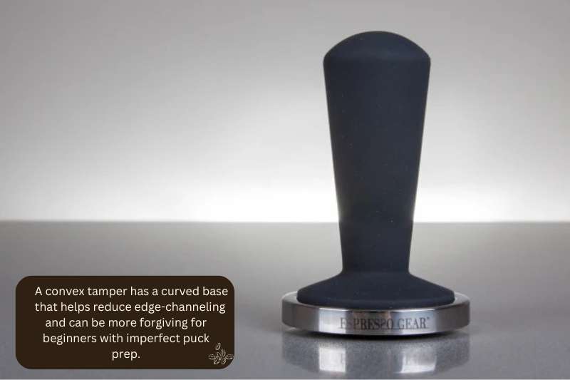 A convex tamper has a curved base that helps reduce edge-channeling and can be more forgiving for beginners with imperfect puck prep.